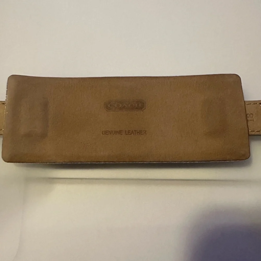 Coach Poppy cuff watch. Genuine leather with silver metallic‎ design. Vintage